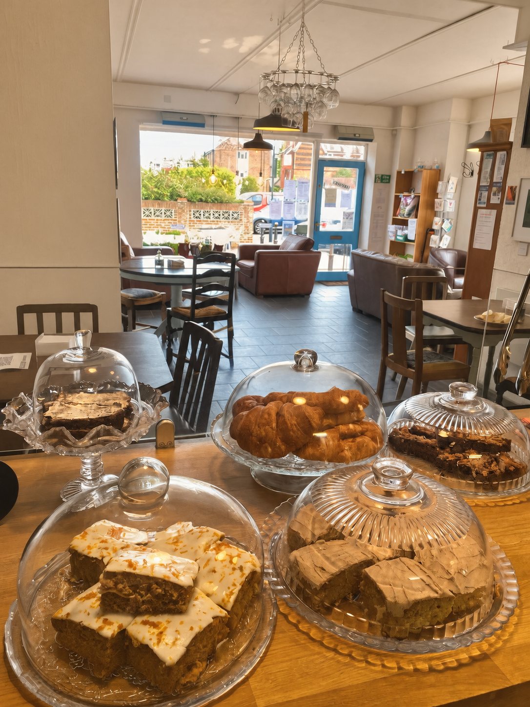 Homemade cakes under glass domes