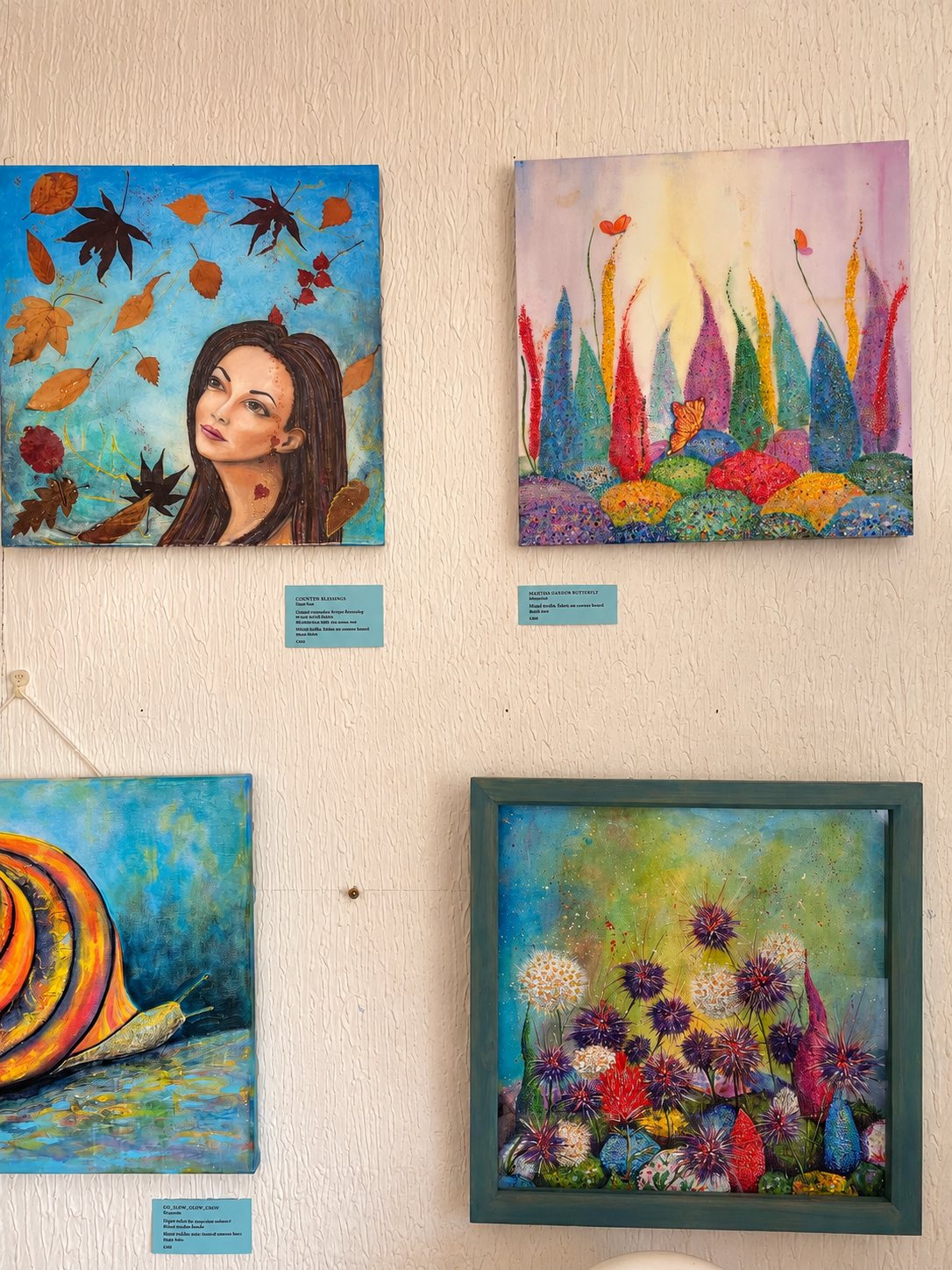 Local artists' paintings on the café wall